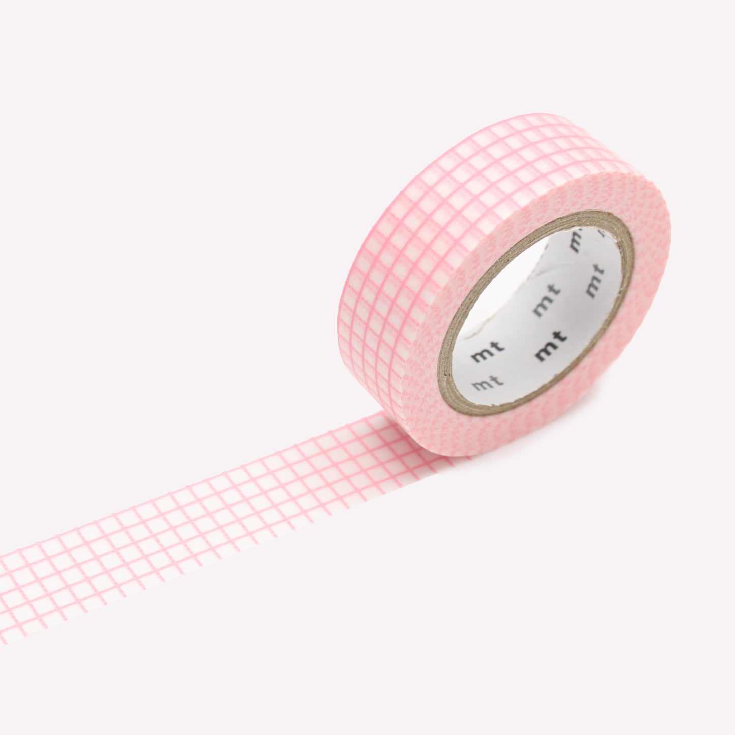 A roll of MT Hougan Sakura washi masking tape with a pink grid pattern. 