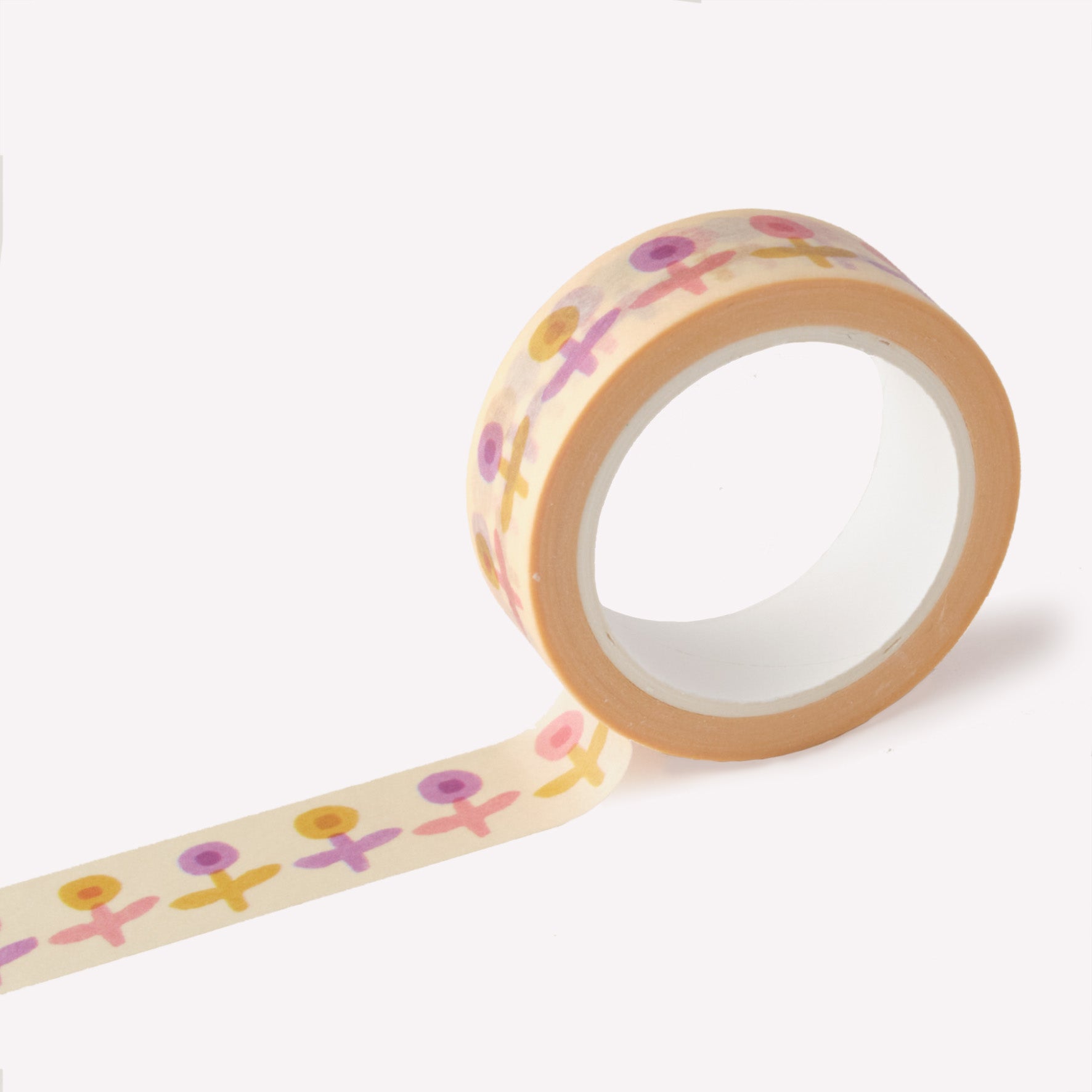 Roll of washi tape designed by Claire Paul, featuring pattern of lilac, yellow and pink flowers on a cream background. Each roll measures 15mm wide and has 10m of tape. 