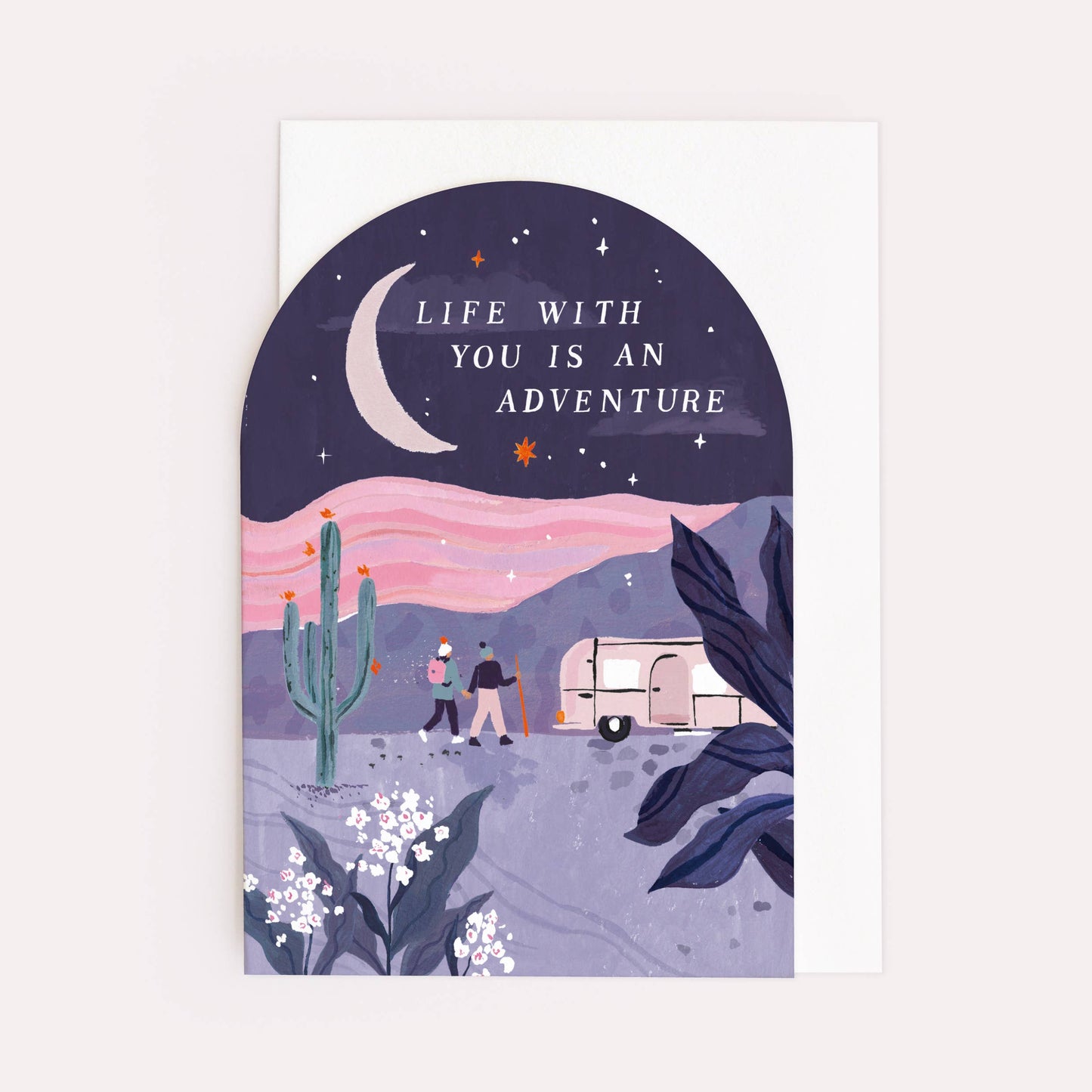 An arch shaped greetings card by Sister Paper Co with an illustration of two people hiking and text that reads "Life With You Is An Adventure".