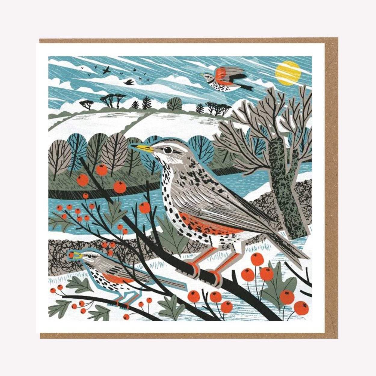 An illustrated greetings card by Matt Johnson, featuring his 'Roseland Redwings' Christmas artwork. The square card is paired with a kraft brown envelope.