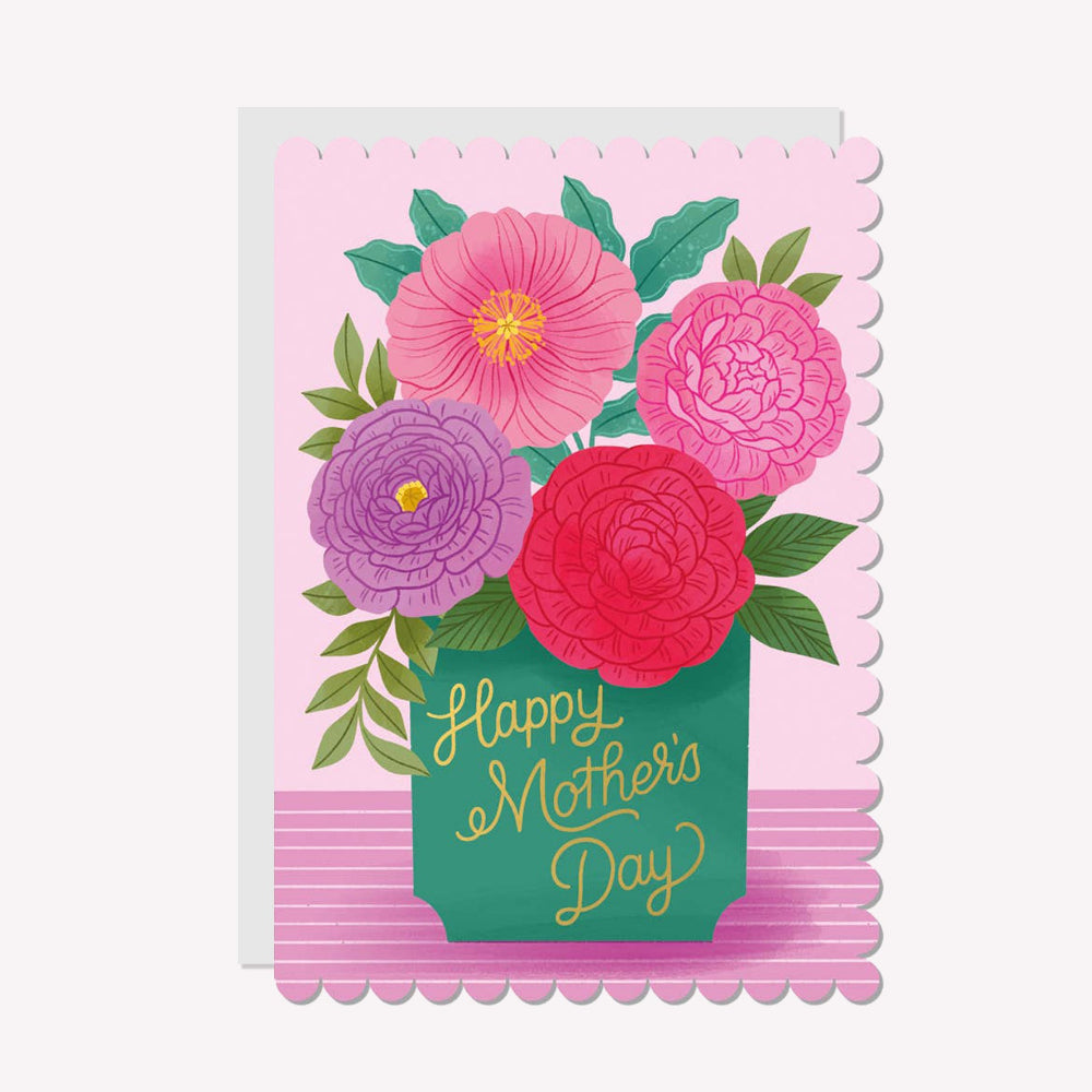 An illustrated Mother's Day card by Raven Paper Co, printed by Ricicle Cards. This card features a vase of large pink flowers, with gold-foiled text that reads “Happy Mother's Day".