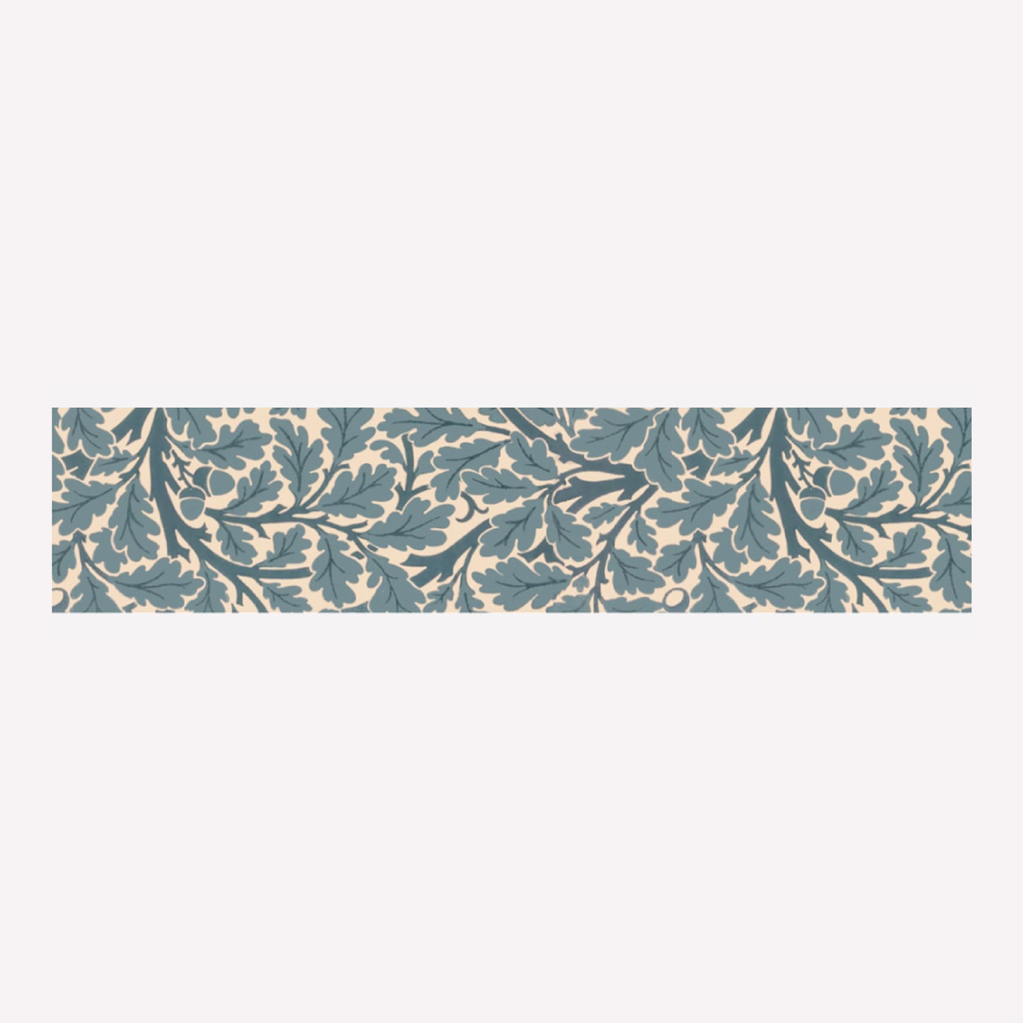 An swatch of MT's Oaktree Morris & Co artist washi tape with an intricate blue pattern of oak leaves on a branch. Each roll is 20mm wide, with 7m of tape.