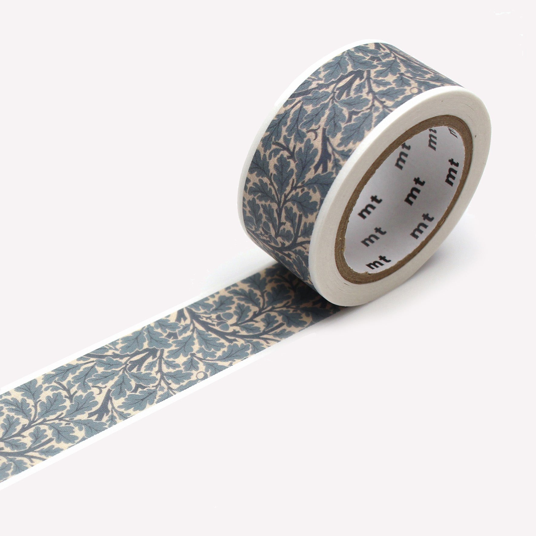 An open roll of MT's Oaktree Morris & Co artist washi tape with an intricate pattern of blue oak leaves on a branch. Each roll is 20mm wide, with 7m of tape.