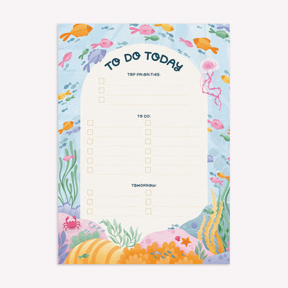 Nyassa Hinde Illustration to do today daily desk planner with a coral reef design and room to write your top priorities and tasks for each day, as well as notes for tomorrow. 