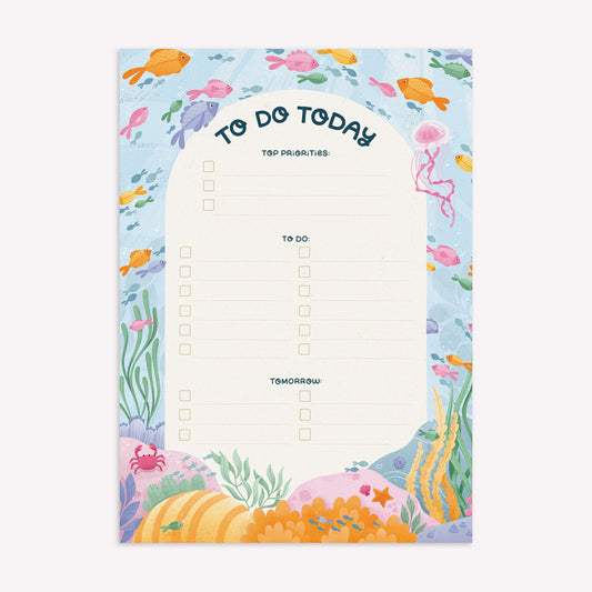 Nyassa Hinde Illustration to do today daily desk planner with a coral reef design and room to write your top priorities and tasks for each day, as well as notes for tomorrow. 