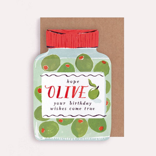 An illustrated greetings card by Sister Paper Co in the shape of an olive jar, with text that reads "Hope Olive Your Birthday Wishes Come True".