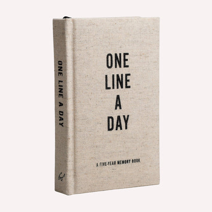 This One Line a Day memory book features a beautiful oatmeal-colored, canvas cloth cover, striking metallic page edges, and a ribbon page marker.