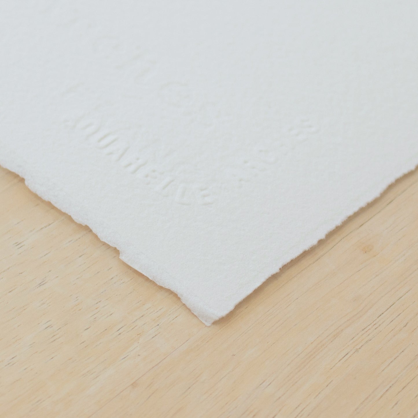 Arches Aquarelle cold pressed watercolour paper with a deckled edge and embossed logo. 