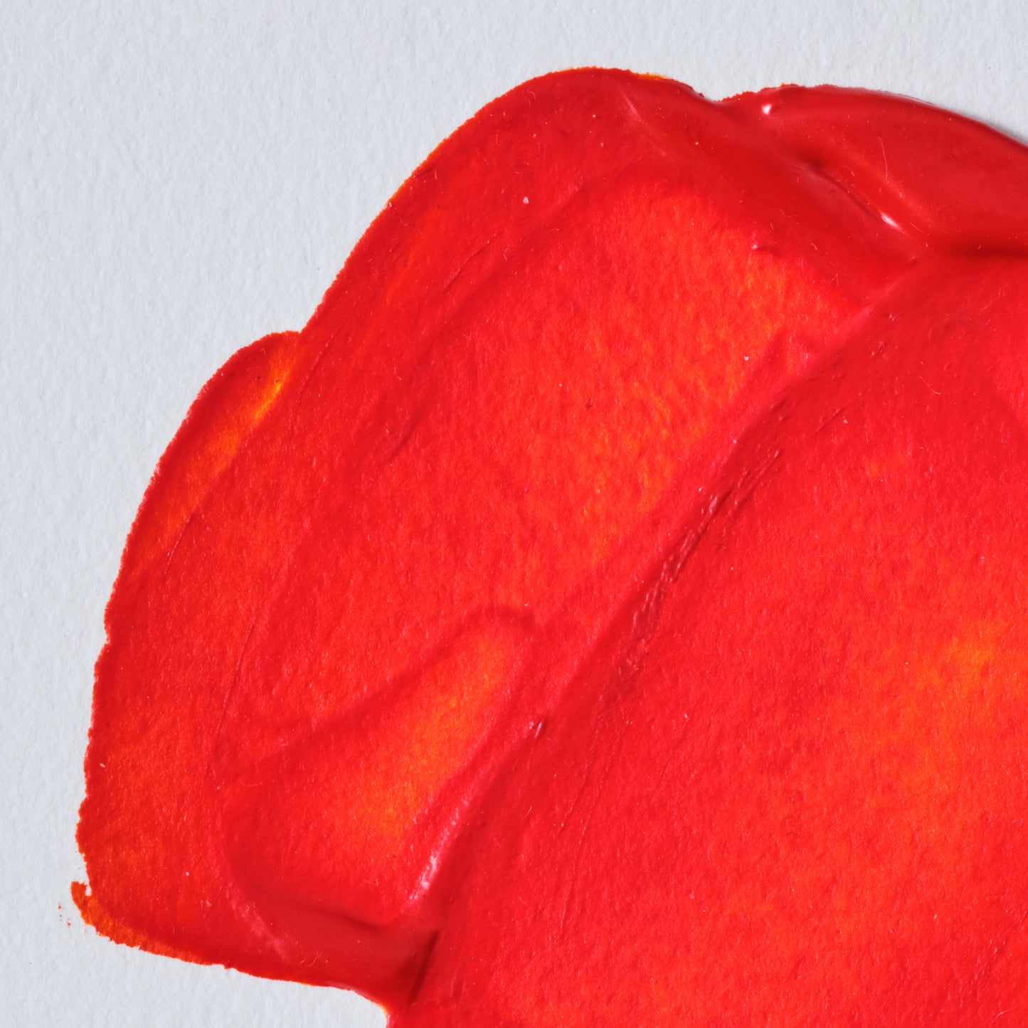 Red paint swatch of Liquin Original oil colour medium creating a smooth, gel like paste that is easy to work with. 