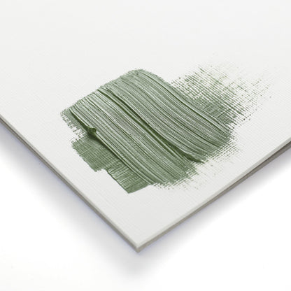 Sample of Winsor & Newton's Artist A4 oil paper pad with green paint applied thickly on the canvas-textured surface. 